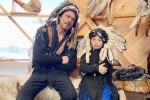 Shah Rukh Khan with Native American War Bonnet, shahrukh khan biography, shah rukh khan and his son abram trolled for sporting native american war bonnets, Trifle